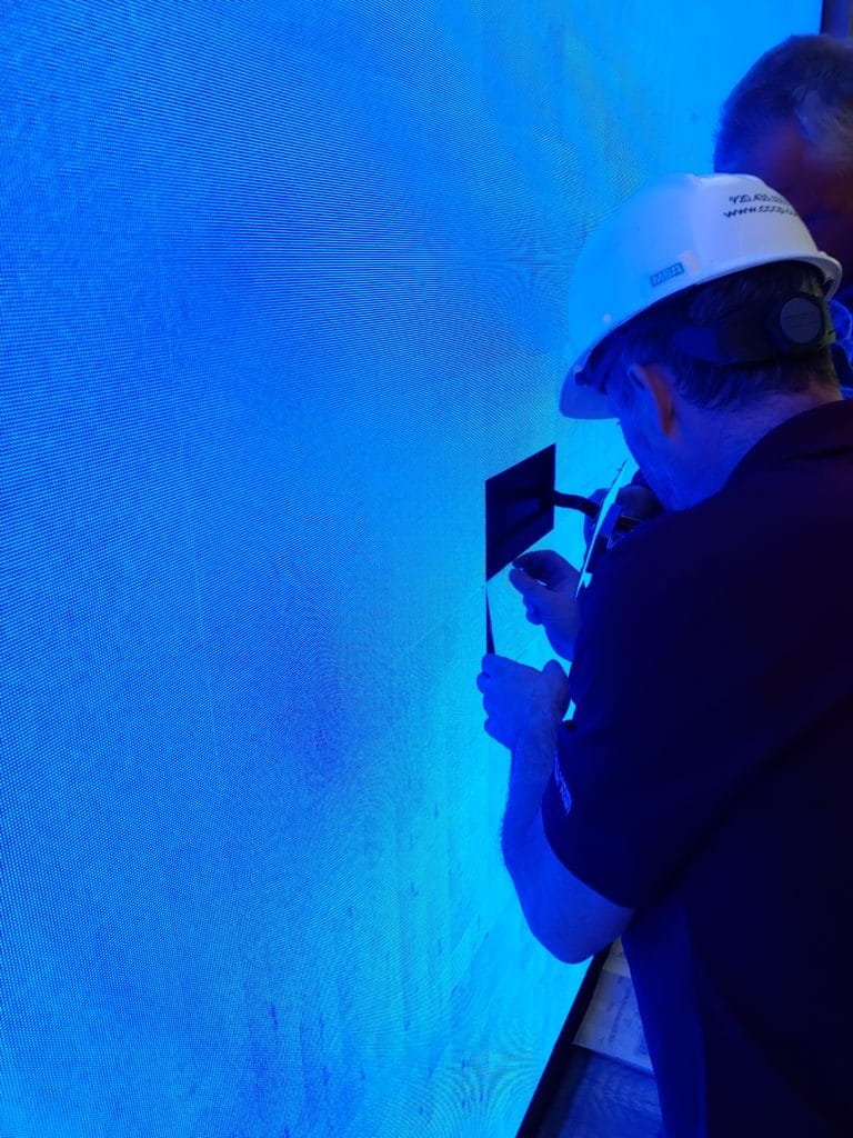 audio visual team installing video wall camera corner connecting point green bay wisconsin